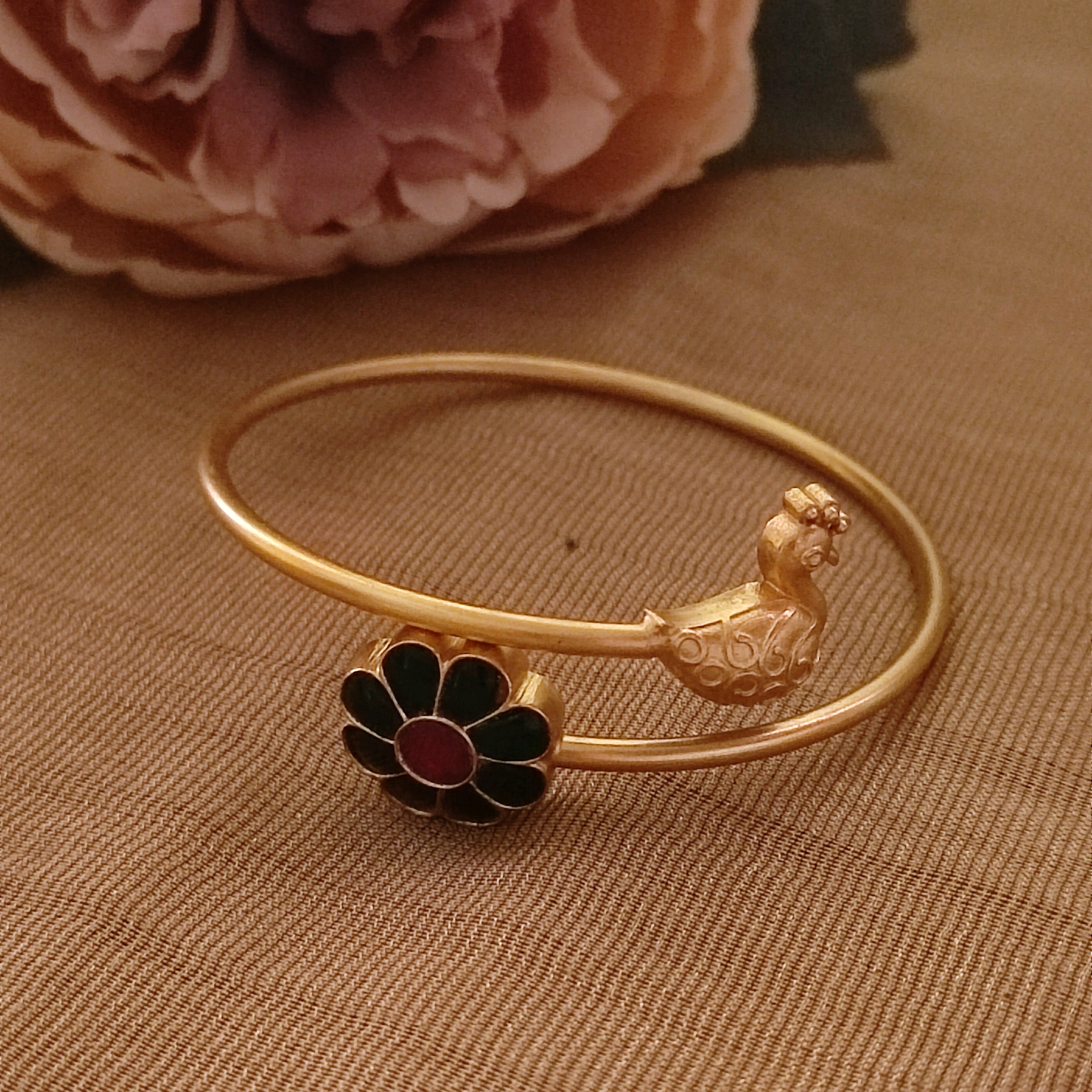 Green kundan flower with golden bird bracelet 